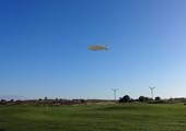 12-m-rc-blimp-flying-over-a-golf-course-in-german