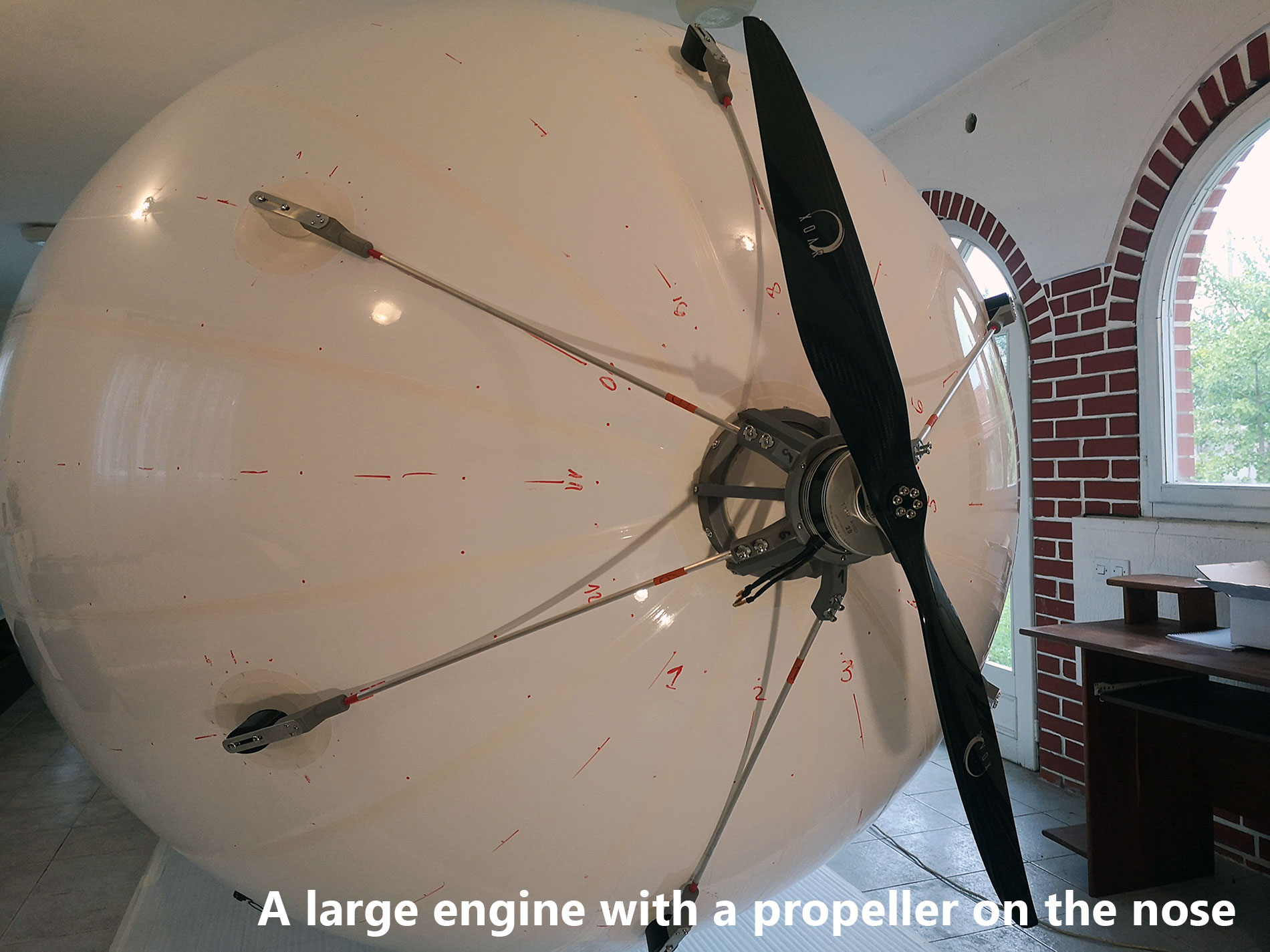 A-large-engine-with-a-propeller-on-the Blimp nose